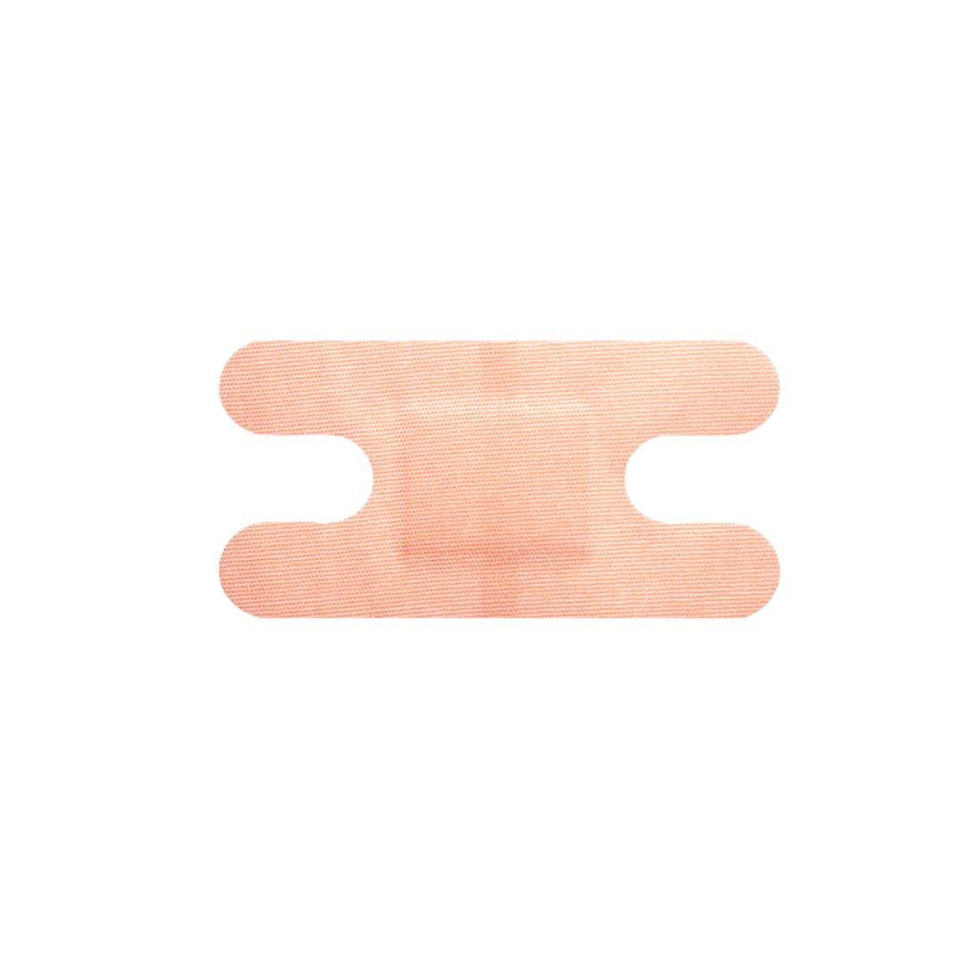 A single peach-colored Dynarex DynaSafety Adhesive Fabric Bandage with rounded ends and side notches is displayed on a white background.